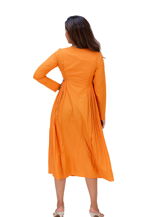 A woman wearing a bright Pomo orange long-sleeve midi dress, shown from the back against a plain white background.